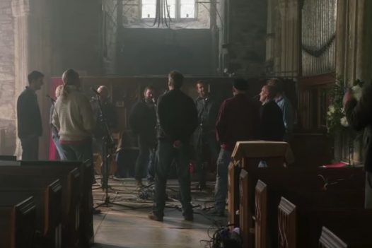 A scene from the Fisherman's Friends movie, filmed in Saint James Church in St Kew