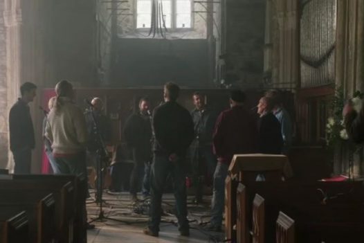 A scene from the Fisherman's Friends movie, filmed in Saint James Church in St Kew