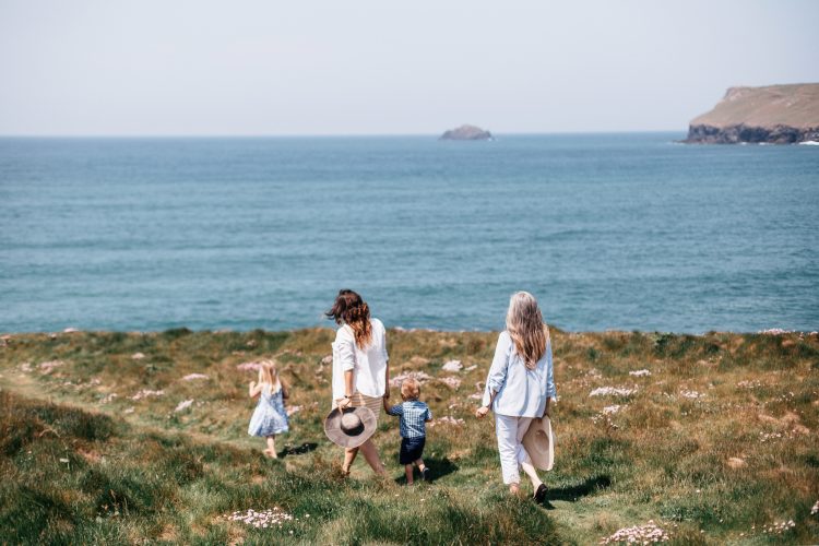 Family on the South West Coast Path above Polzeath Beach