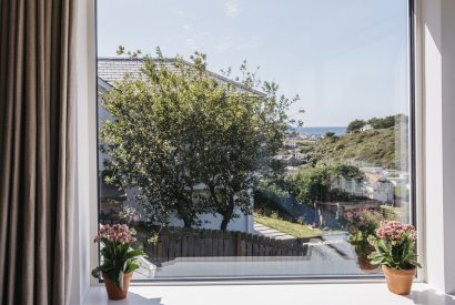Sea view from the master bedroom at Seahouse, a self-catering holiday home in Polzeath, North Cornwall