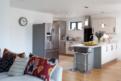 Open plan living space at Clifden, a self-catering holiday home in Polzeath, North Cornwall